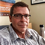 Selfie style picture of Greg in his office